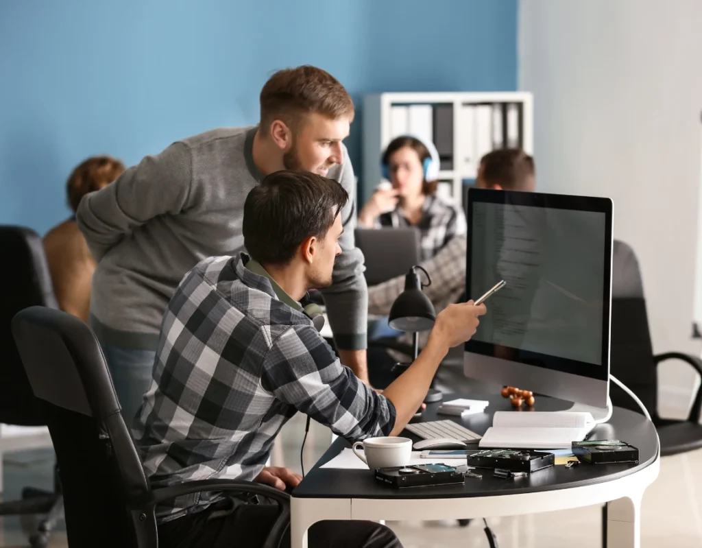 IT professionals collaborating on contingency recruitment solutions in Brampton office.