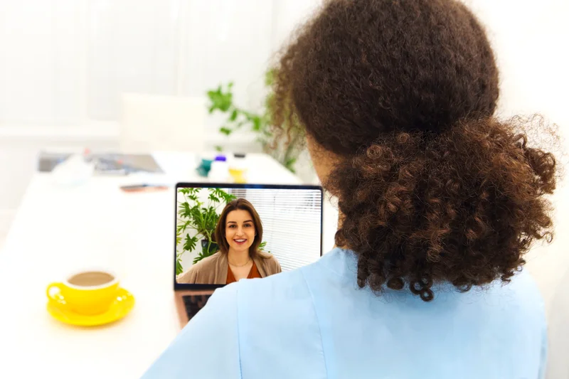 Candidate responding to scenario-based questions on a video call, demonstrating adaptability for Kitchener IT recruitment.