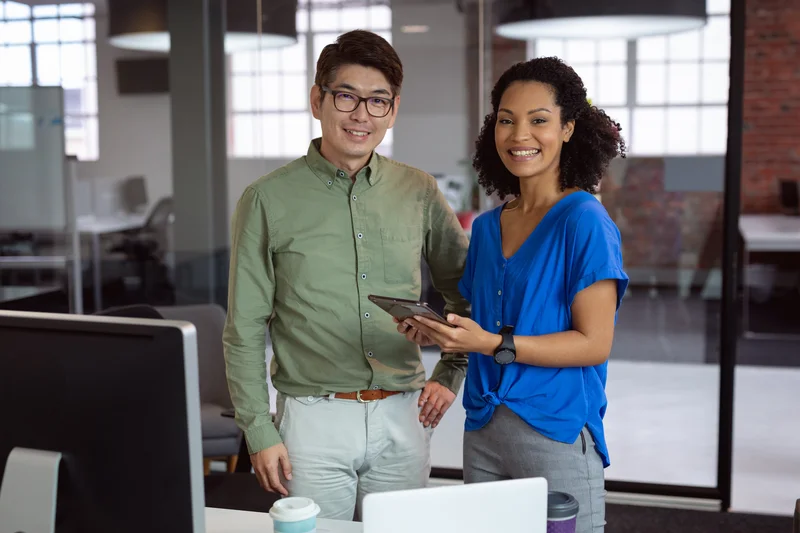 Two professionals collaborating in an office setting, reflecting partnership and candidate support in Ottawa IT recruitment across government, healthcare, and enterprise sectors.