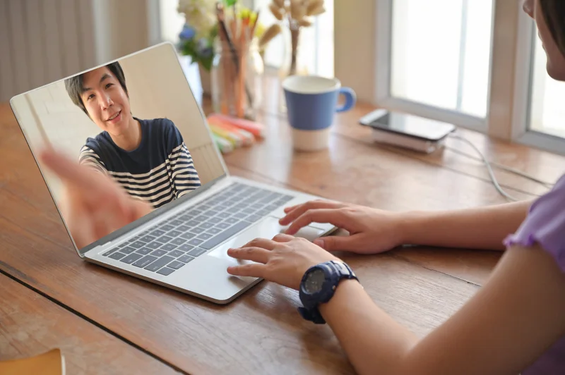 Candidate speaking with a recruiter over video call during an interview, demonstrating communication and technical knowledge.