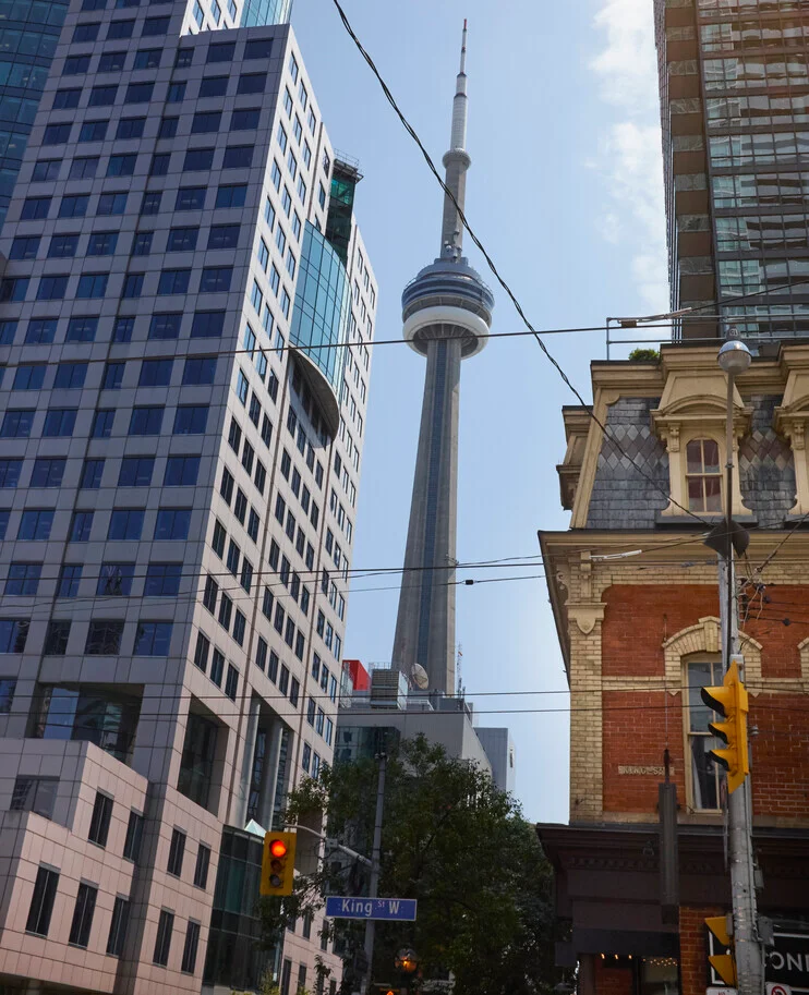 The CN Tower surrounded by downtown Toronto office buildings, symbolizing STACK IT’s ability to hire tech talent in Toronto for employers across industries.