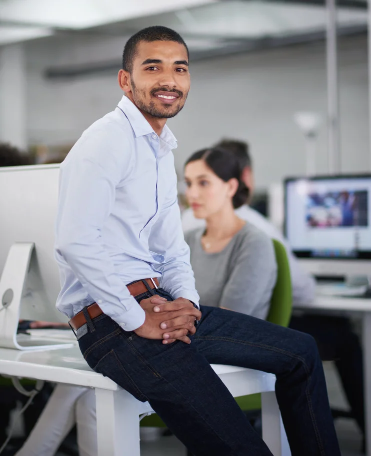 Business professional in a casual discussion at a Canadian firm specializing in IT staffing services.